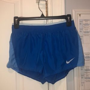 Blue Nike running shorts